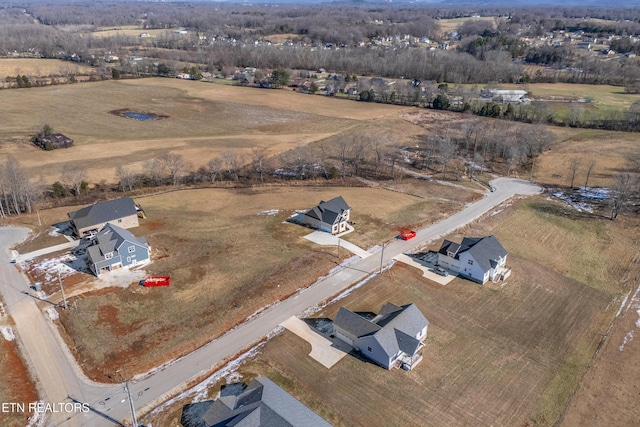 birds eye view of property featuring a rural view