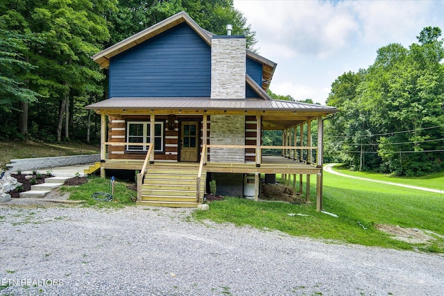 view of front facade with a front lawn and a porch