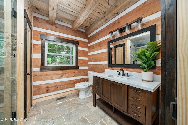 bathroom with wood walls, beamed ceiling, vanity, toilet, and wooden ceiling