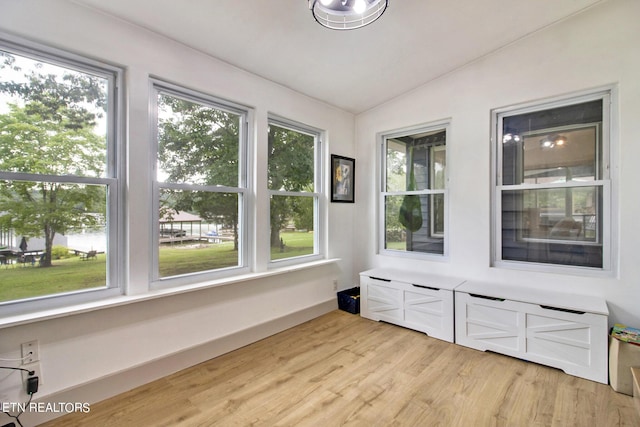 sunroom featuring lofted ceiling