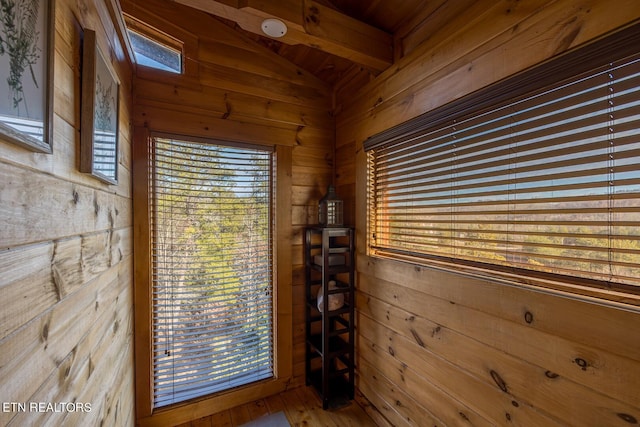 room details featuring hardwood / wood-style flooring and wooden walls