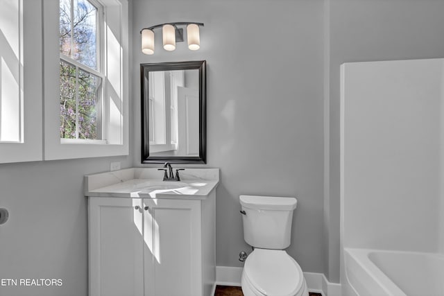 full bathroom featuring shower / bathtub combination, vanity, and toilet