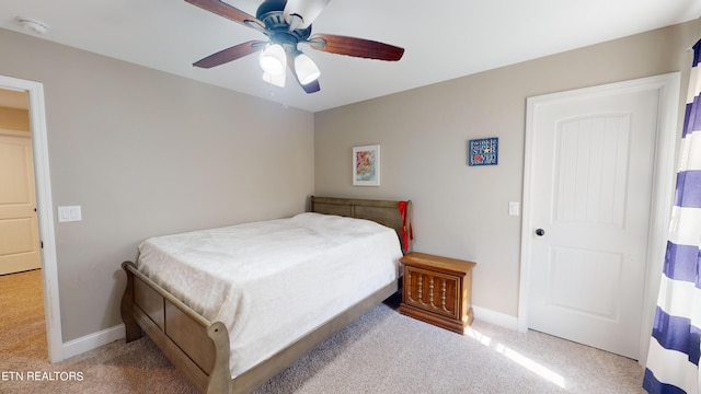 bedroom featuring light carpet and ceiling fan