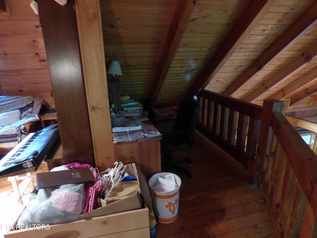 interior space featuring beamed ceiling, wood ceiling, and wood-type flooring