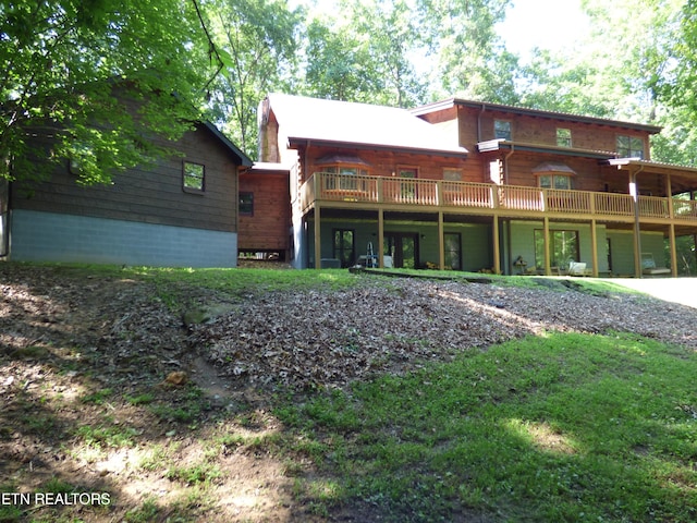 back of property with a deck