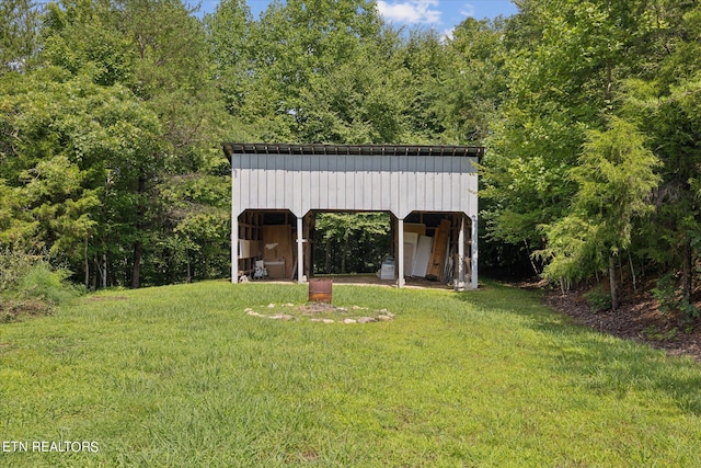 view of outbuilding featuring a lawn