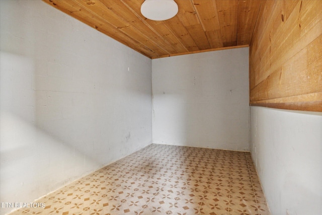 empty room with wood ceiling