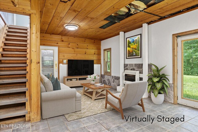 living room featuring heating unit and wood ceiling