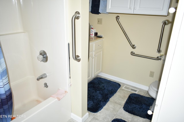 full bathroom with tile patterned flooring, toilet, vanity, and shower / tub combo with curtain