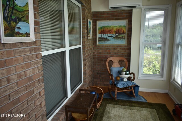 sunroom with a wall unit AC