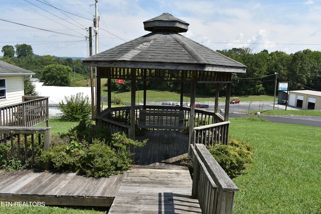 deck with a lawn and a gazebo