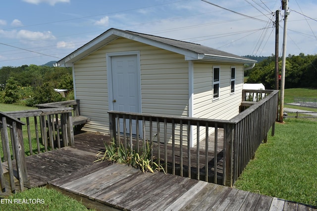 wooden deck with a yard