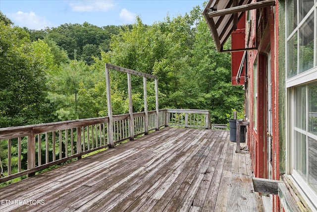 wooden terrace featuring central AC unit