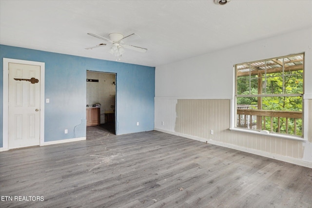 spare room with ceiling fan and hardwood / wood-style floors