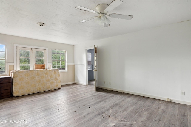 unfurnished room featuring ceiling fan and light wood-type flooring