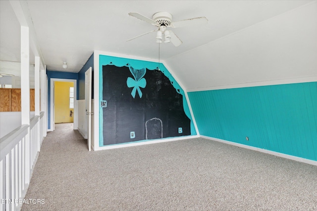 additional living space with vaulted ceiling, ceiling fan, and carpet flooring