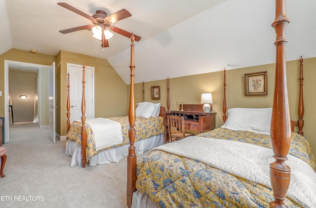 bedroom featuring lofted ceiling, ceiling fan, and carpet flooring