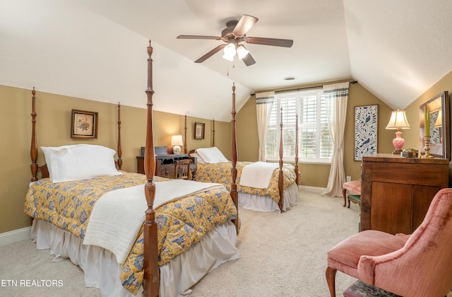 carpeted bedroom with lofted ceiling, baseboards, and a ceiling fan