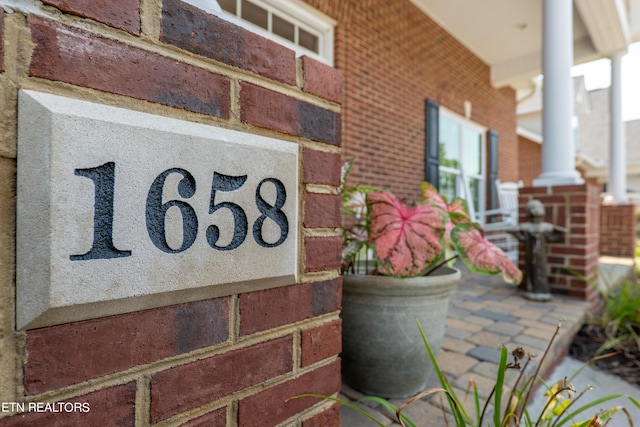 details with brick siding and ornate columns