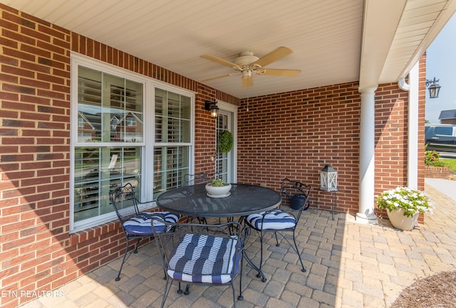 view of patio featuring outdoor dining area and ceiling fan