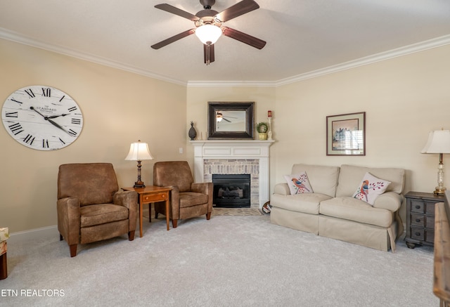 living room featuring ornamental molding, a brick fireplace, light carpet, and ceiling fan