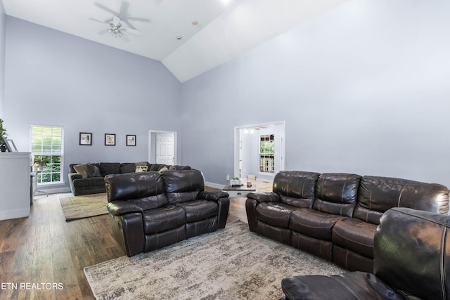 living room featuring a healthy amount of sunlight, high vaulted ceiling, ceiling fan, and hardwood / wood-style floors