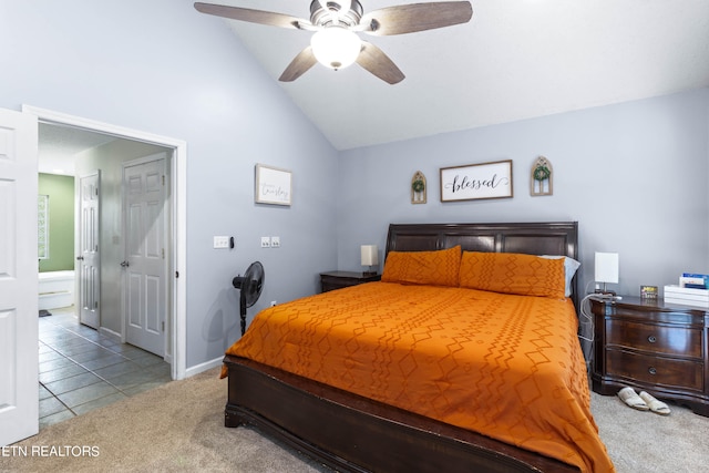 bedroom with ensuite bath, ceiling fan, lofted ceiling, and light colored carpet