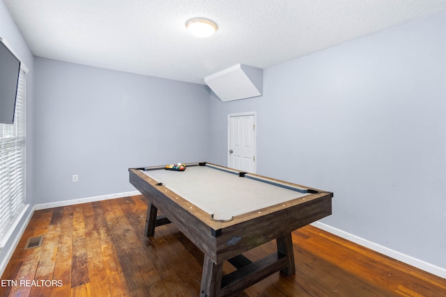 playroom with pool table, hardwood / wood-style floors, a wealth of natural light, and a textured ceiling