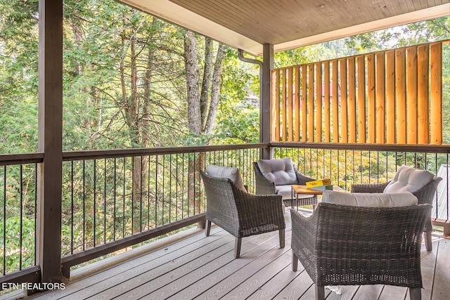 wooden deck featuring an outdoor living space