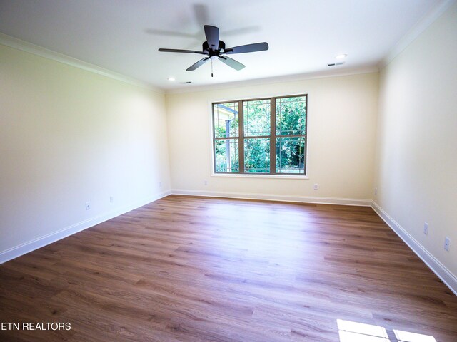 spare room featuring ceiling fan, hardwood / wood-style flooring, and ornamental molding