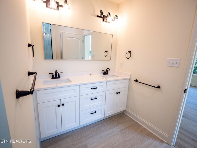 bathroom featuring tile patterned floors and vanity