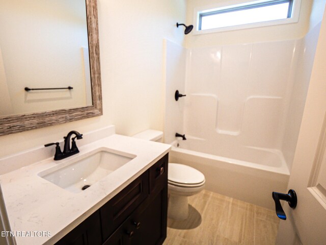 full bathroom with tub / shower combination, toilet, and vanity