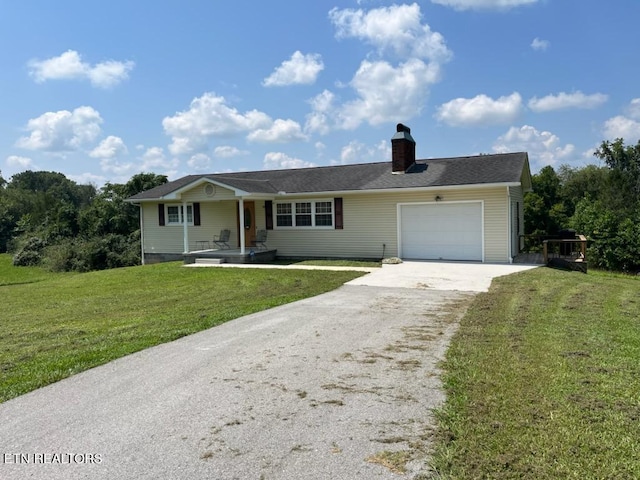 view of front facade featuring a garage and a front lawn