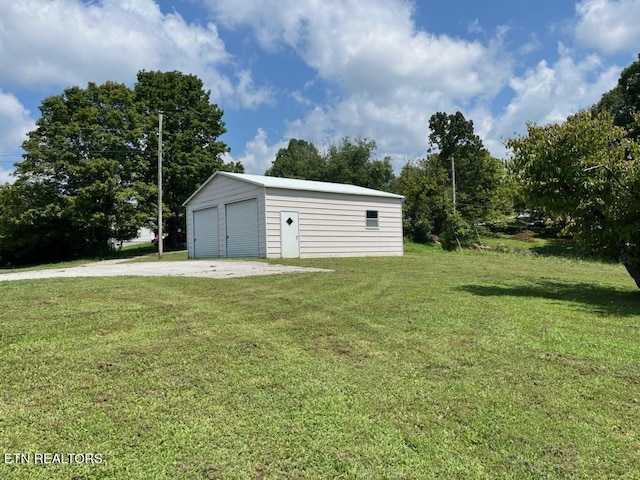 garage featuring a yard