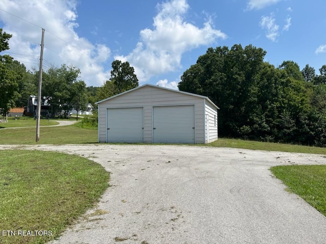 garage with a lawn