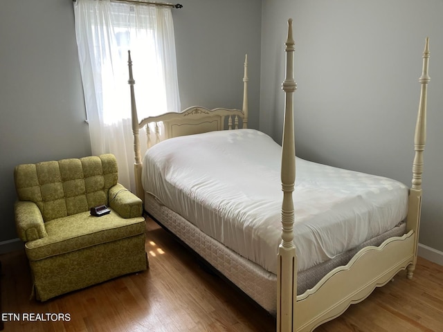 bedroom with wood-type flooring