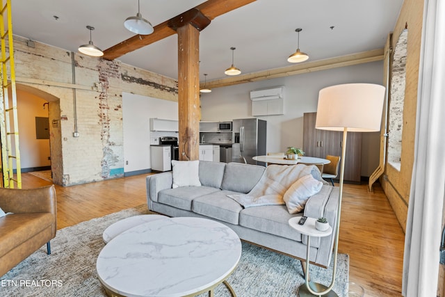 living room with light wood-type flooring and electric panel