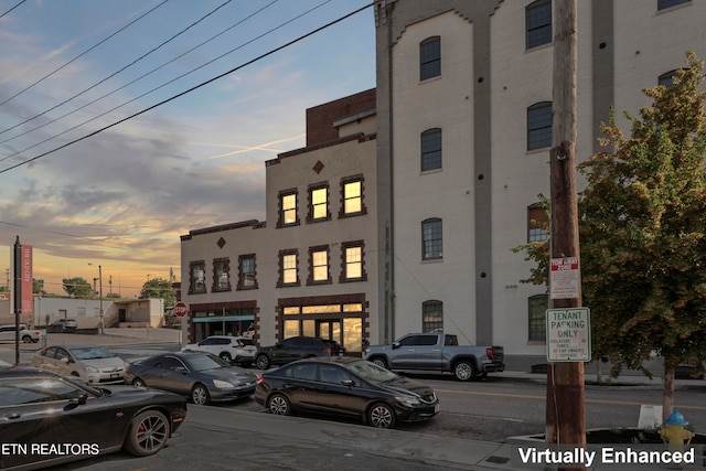 view of outdoor building at dusk