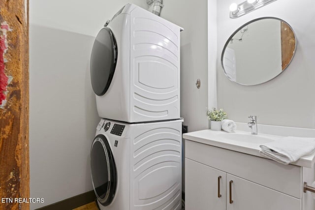 laundry room with sink and stacked washer and dryer