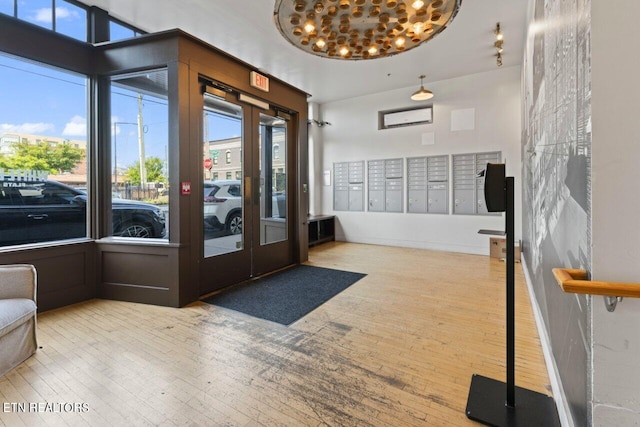 interior space featuring light hardwood / wood-style flooring and a mail area