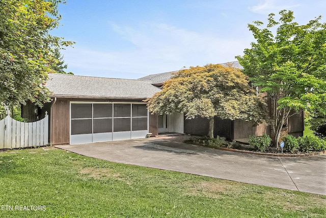 view of front of home with a patio area and a front yard