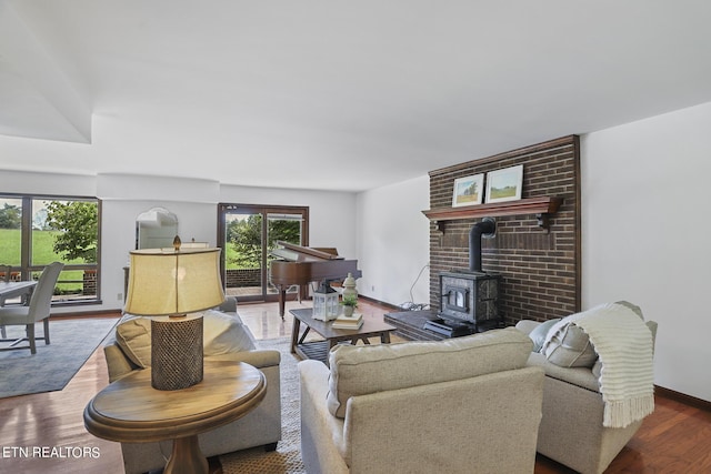 living room featuring hardwood / wood-style floors and a wood stove