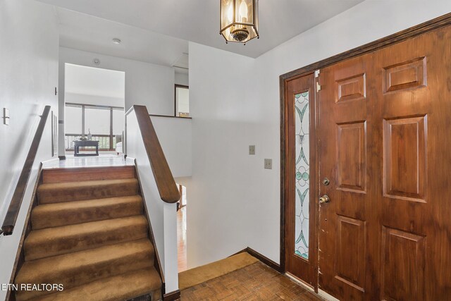 entrance foyer with dark parquet flooring