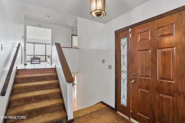 entrance foyer with dark parquet floors