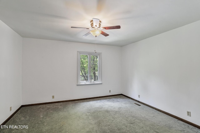 empty room featuring ceiling fan and carpet flooring