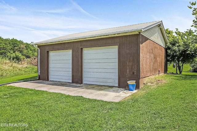 garage with a lawn