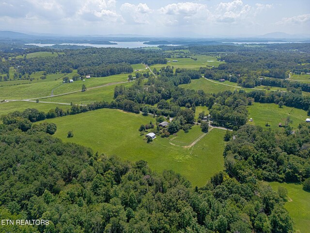 bird's eye view with a water view and a rural view