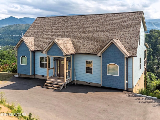 view of front of property with a mountain view