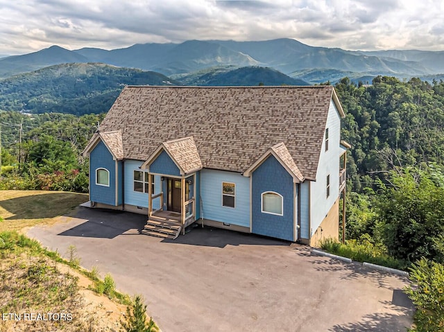 view of front of property with a mountain view