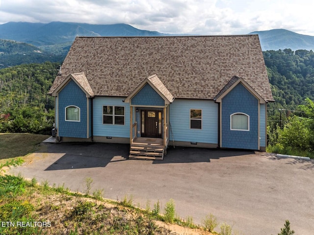 view of front of home featuring a mountain view